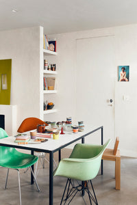 retro style dining area with 70s ceramics coffee tumblers and butterdish and wine glass