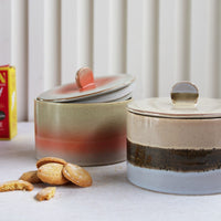 two ceramic cookie jars in orange and blue color tones 
