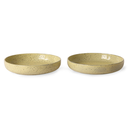 two yellow speckled deep paste plates