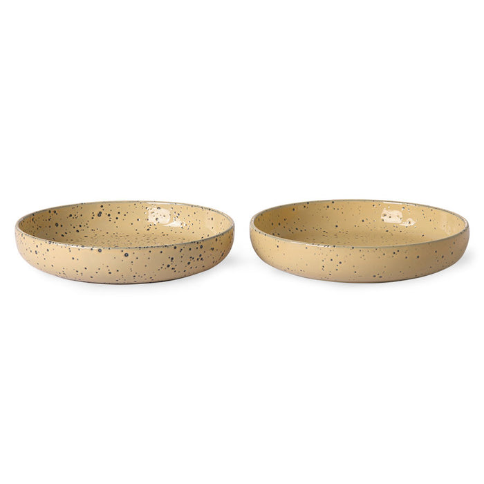 set of two peach colored round deep dishes made from speckled stoneware