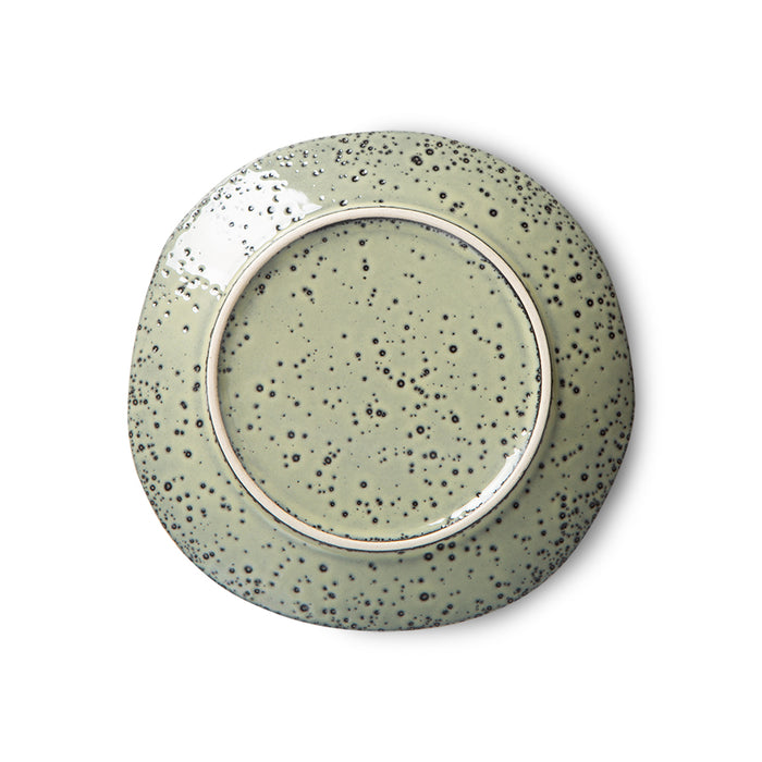 back of a stoneware green colored appetizer plate