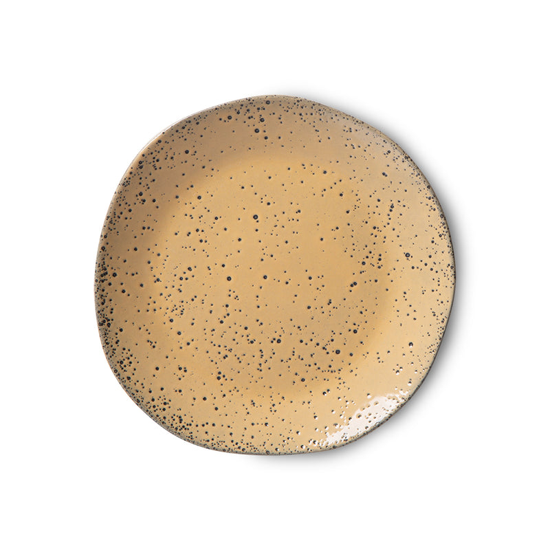 front of a peach colored appetizer plate