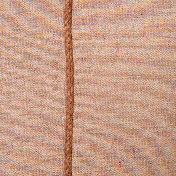 detail of brown stiches on cotton