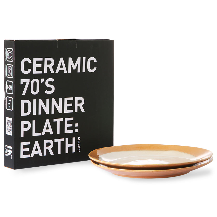 two earth colored stoneware dinner plates and a black gift box