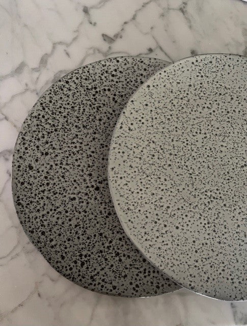 variation in grey and cream colors on gradient ceramic plates