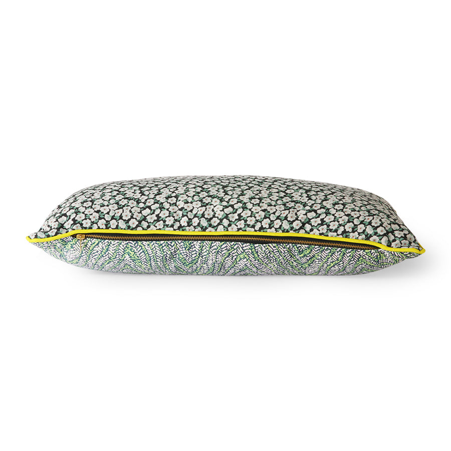 green floral print pillow with yellow trim and zipper