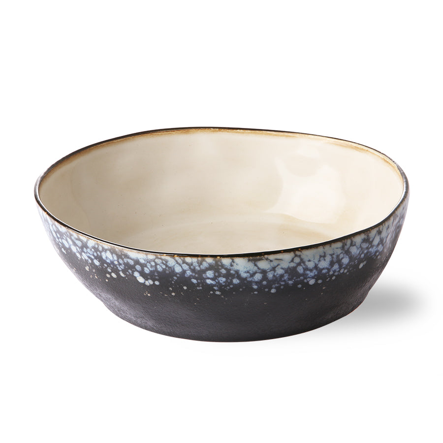 stoneware wide bowl with black outer side and cream colored inside