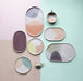 pastel colored stoneware oval and round plates