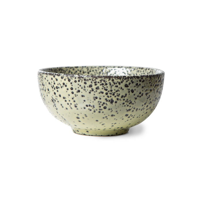 green bowl made from stoneware in a green color with a speckled finish