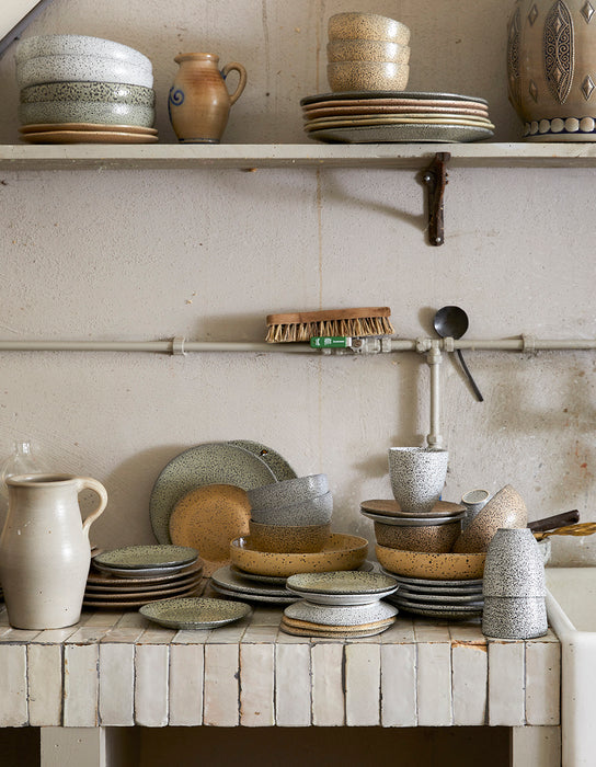 vintage style kitchen with organic shape speckled ceramics in earth colors