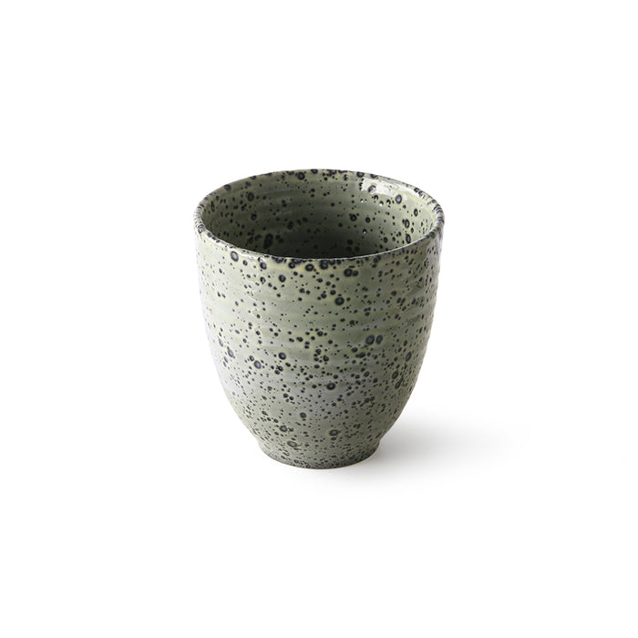 green ceramic mug with speckled glaze