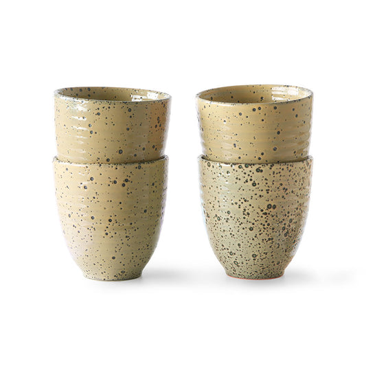 set of 4 mugs with a peach colored speckled glaze