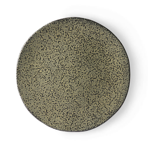 green ceramic dinner plate with a speckled finish