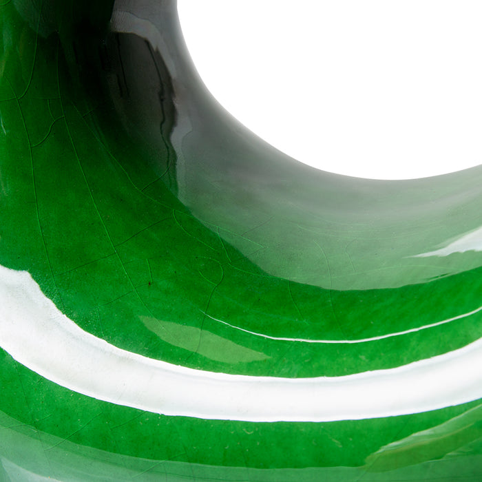 detail of cracked glossy finish on green sculpture