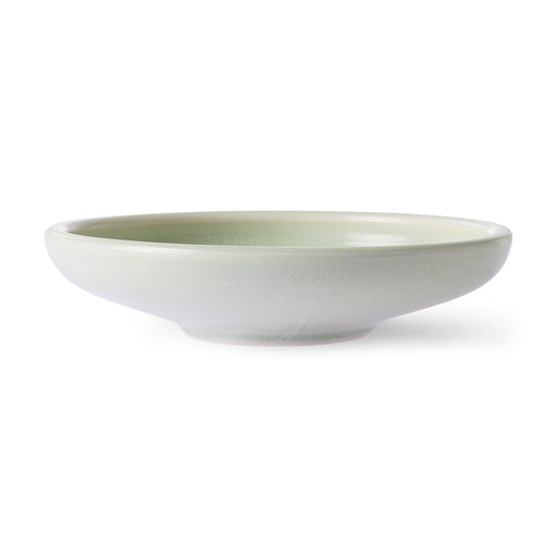 side view of a deep side plate in mint green and white