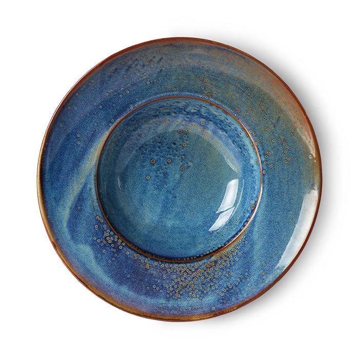 deep blue pasta plate with reactive glaze in blue brown and green