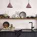 kitchen with open shelving and ceramic plates bowls and cups