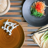 brown and black dinner plates with fresh food
