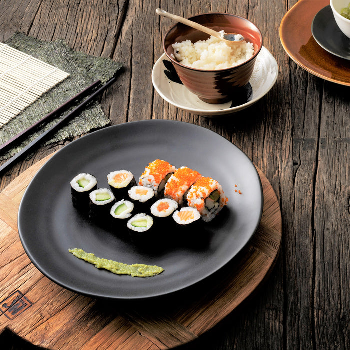 black plate with flat finish filled with sushi