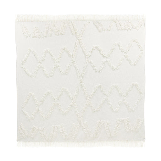 white cotton bedspread with textured turfed lines and fringes