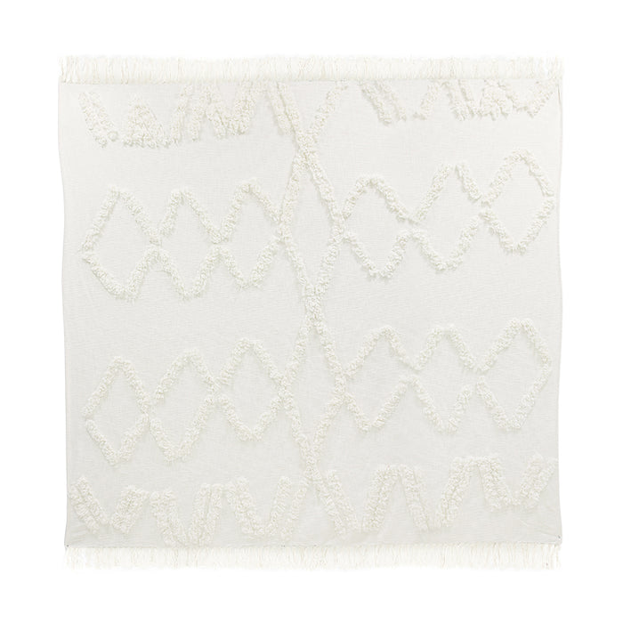 white cotton bedspread with textured turfed lines and fringes