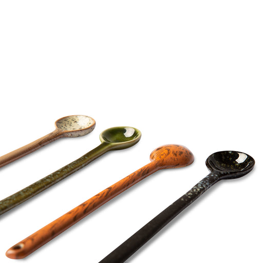 four different colors long ceramic spoons with pattern 