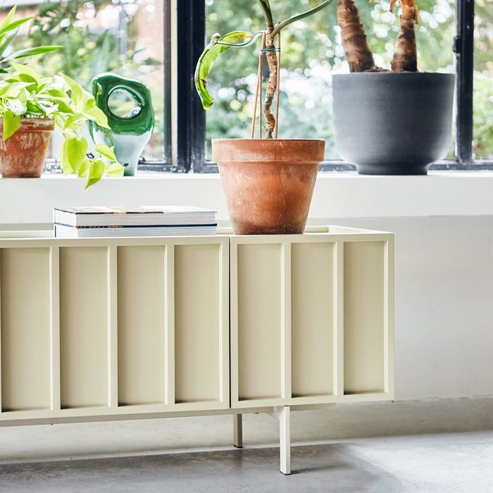 close up of low sideboard in a light color with a contemporary design