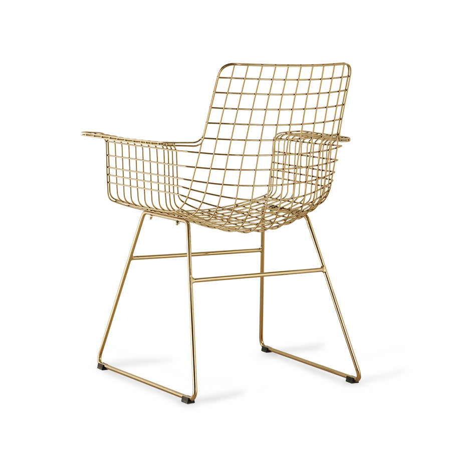 brass colored tub chair with arms made of metal