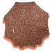 top view of vintage style retro umbrella with orange fringes and brown floral pattern