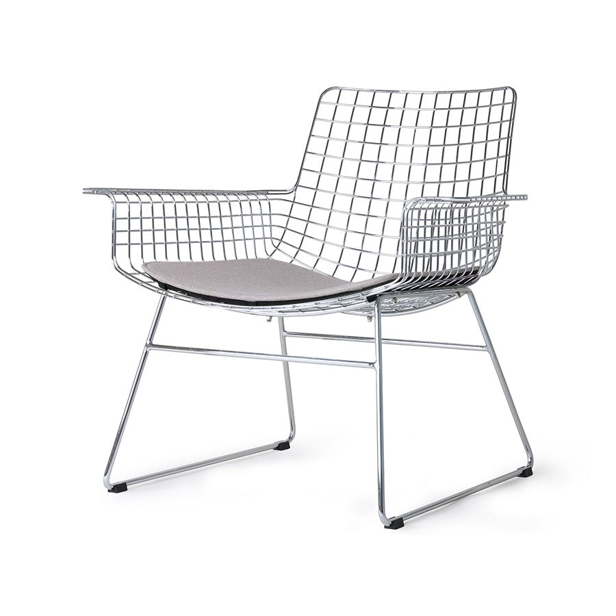 mid century modern style armrest chair in chrome with seat cushion in a light color