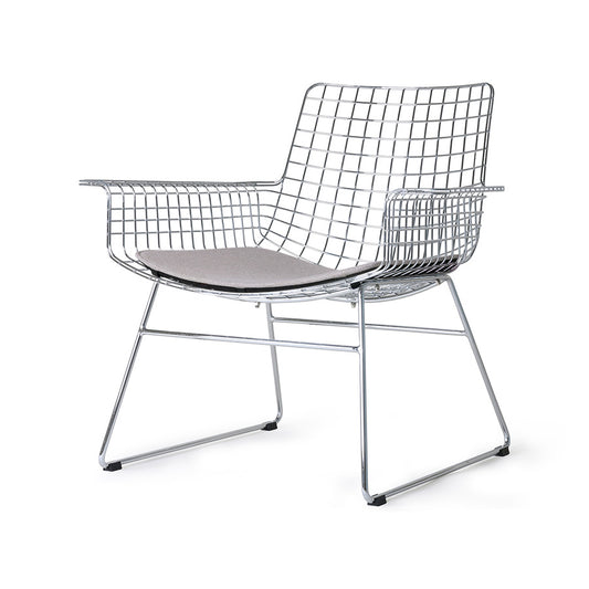 mid century modern style armrest chair in chrome with seat cushion in a light color