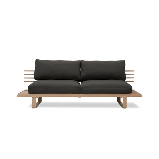 chai colored outdoor sofa with black seating cushions