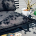 cdetail of the outdoor black sofa with charcoal seating cushion