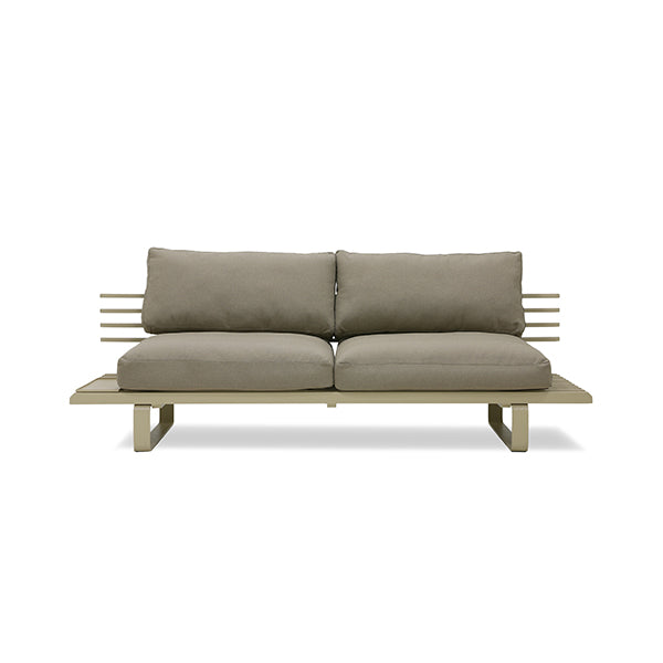 olive green outdoor sofa with beige pillows