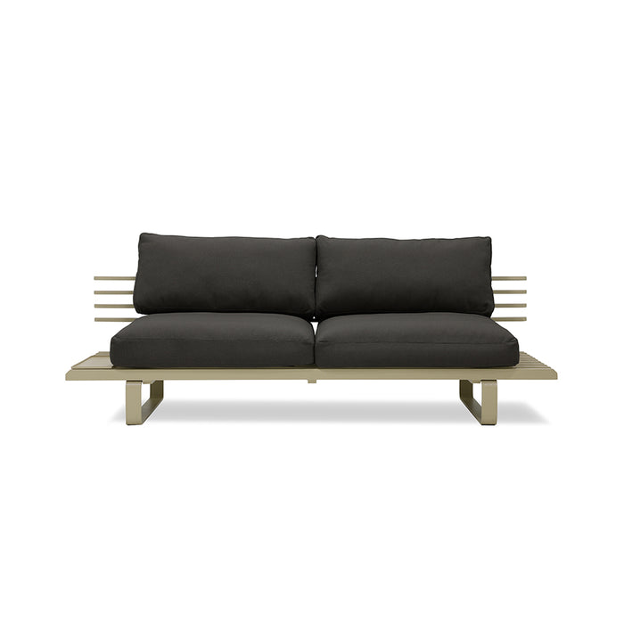olive colored modern style outdoor sofa with black cushions