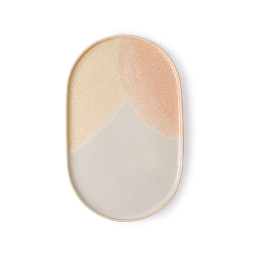 oval shaped side plate with soft yellow and peach and taupe colored finish