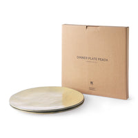 2 peach colored dinner plates and a carton gift box
