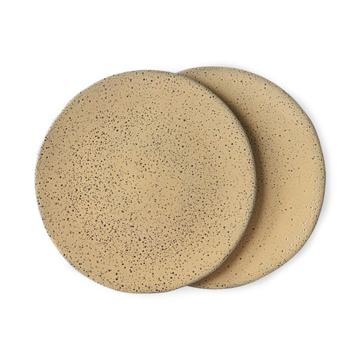 two organic shaped plates with dark speckles