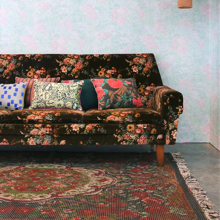 retro style sofa with rose kelim rug 
