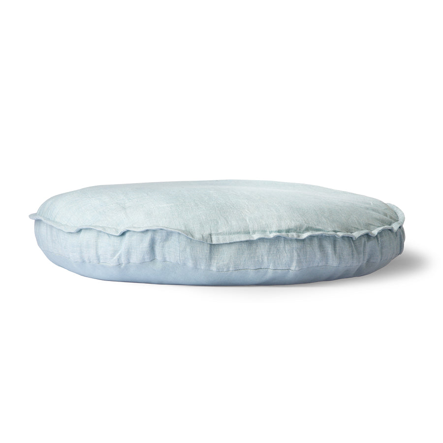 side view of a round linen seating cushion in the color blue