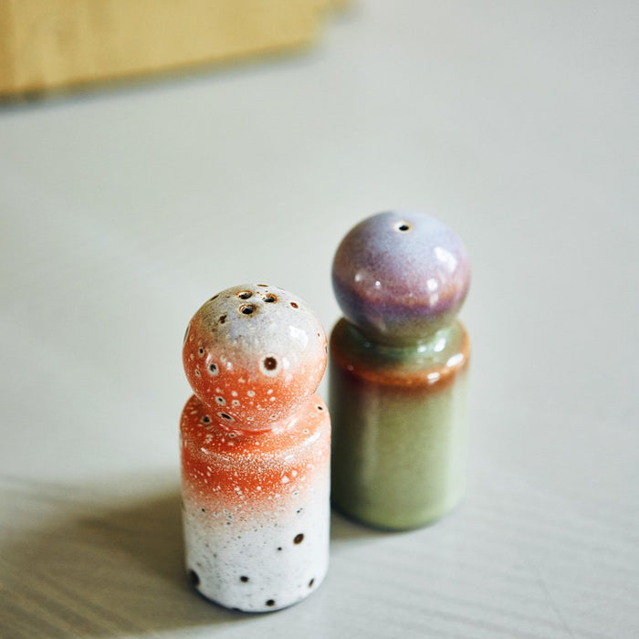 close up of top of salt and pepper shakers in retro design 