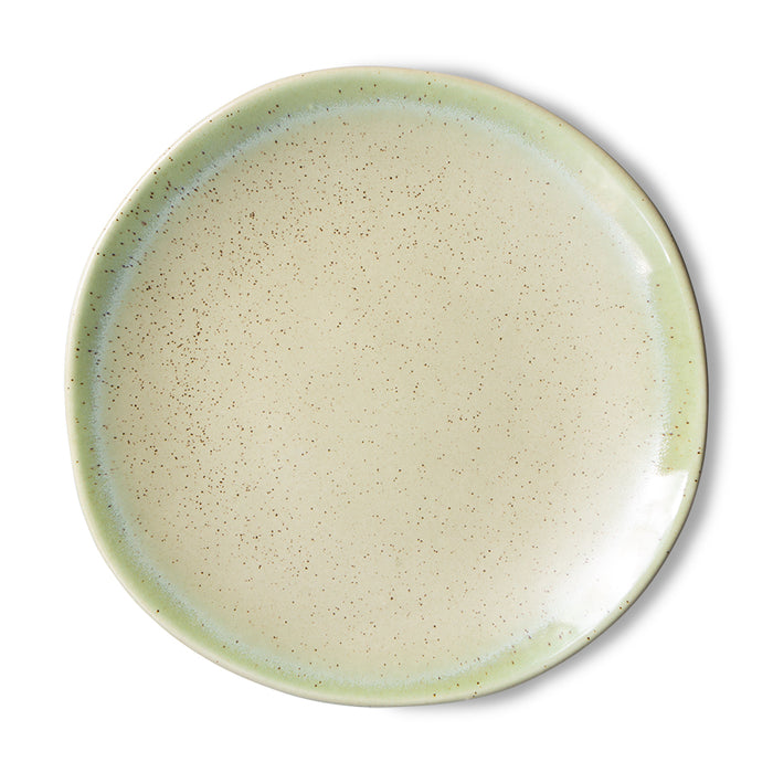 front of a green speckled side plate