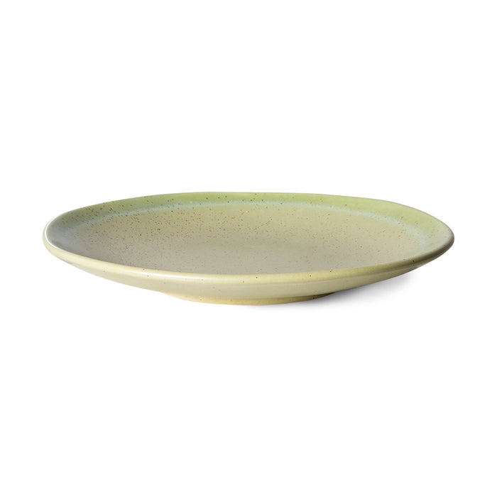 side view of a stoneware side plate in soft green