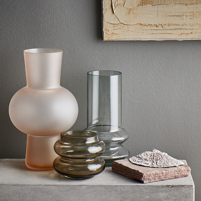 frosted peach colored vase and a brown vase and a grey glass vase