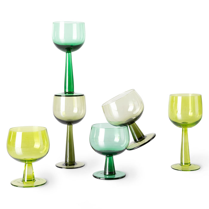 low and high stem wine glasses in green colors