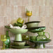 green colored tableware stacked up