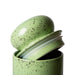 detail of green colored storage jar with silicone ring