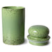green stoneware  storage jar with lid next to it