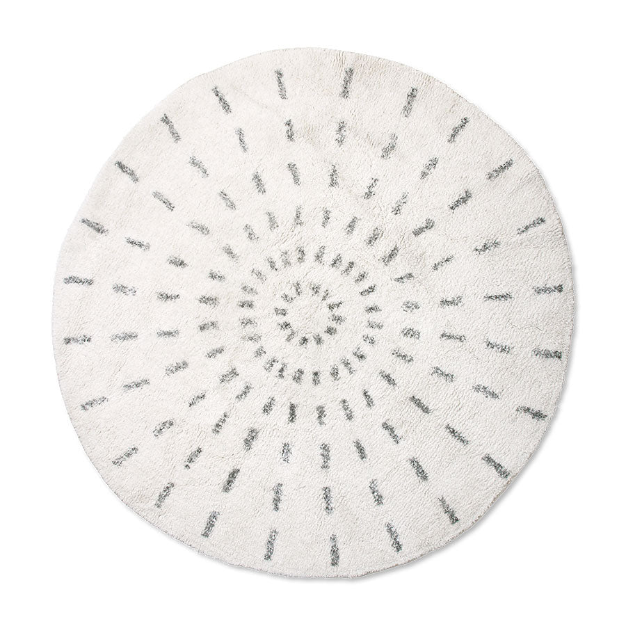 round rug with black and white swirl pattern