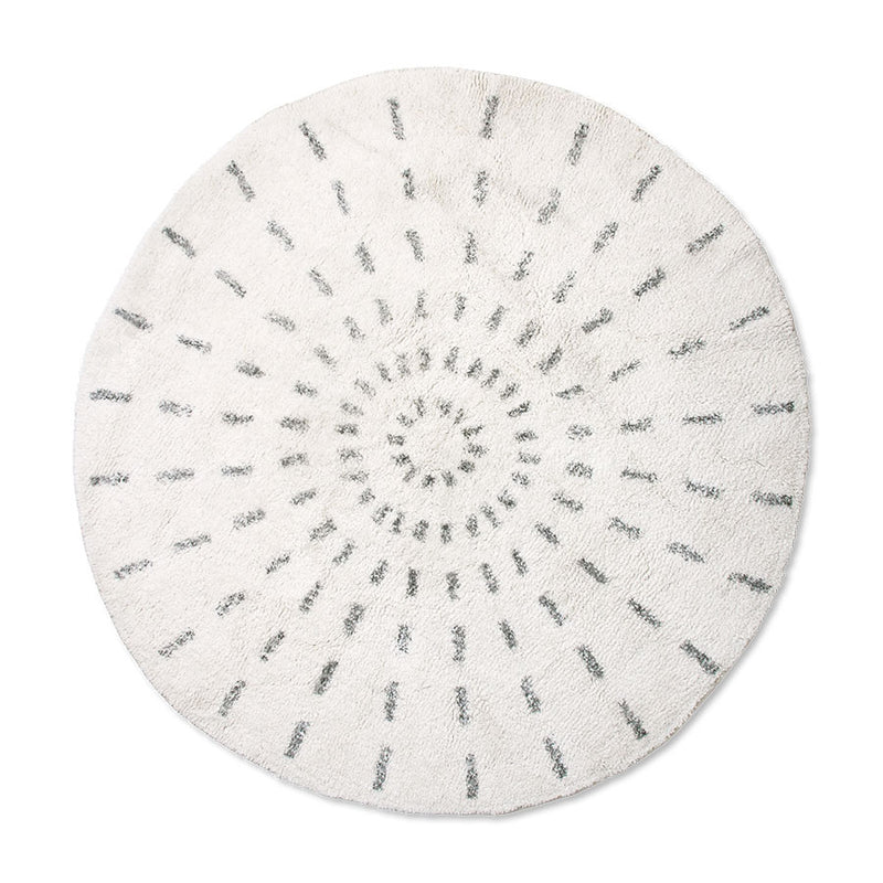 round rug with black and white swirl pattern